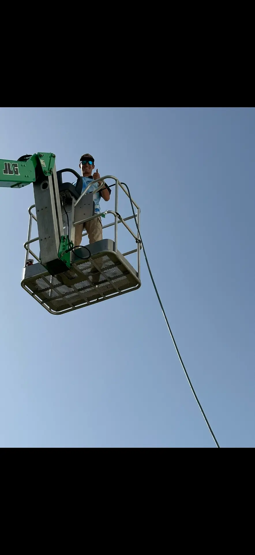 Kohlten Parlari running a boom lift on a Brazos Pro Wash job